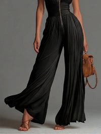 Mélaine · Mono Negro de Gasa con Cremallera y Pantalón Palazzo Plisado
